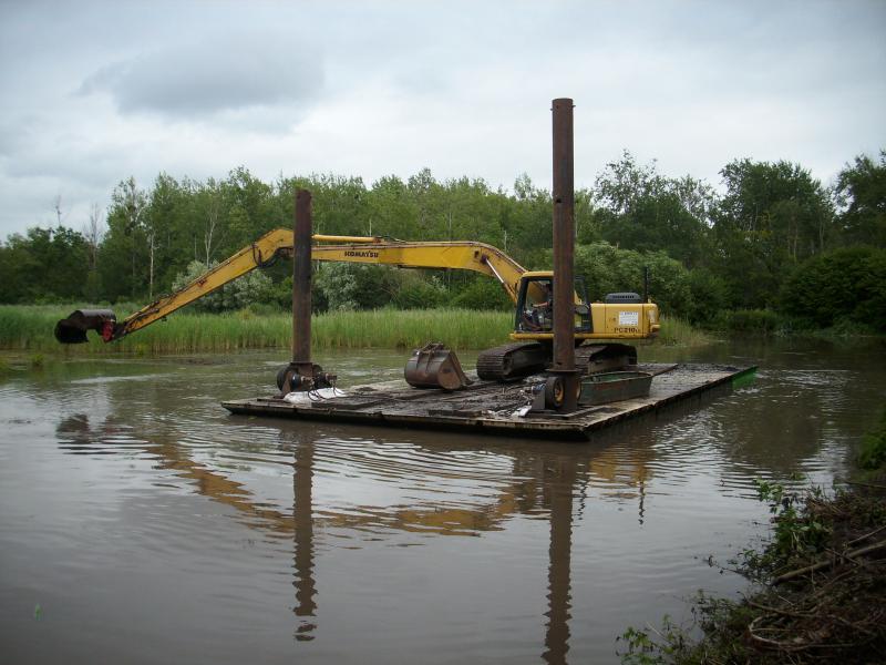 Elimination d’un foyer de myriophylle sur une mare de gabion